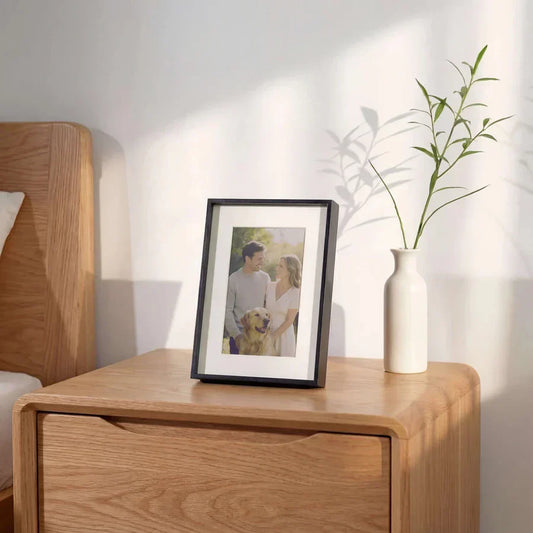 Black digital picture frame for bedroom with family photo on nightstand