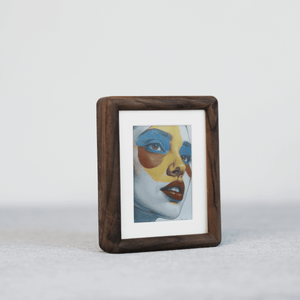 Kokonna 4-inch Wireless E-Ink Art Frame, featuring a walnut wood front view, displays vibrant AI-generated abstract artworks.