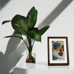 Kokonna 7.3 inch wireless E-ink art frame in solid black walnut front view displaying colorful AI generated abstract art